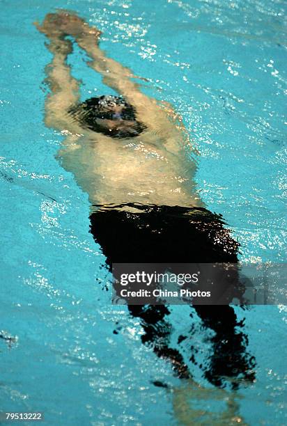 Meeuw Helge of Germany competes during the men's 200-meter backstroke preliminary round, during 'Good Luck Beijing' World Swimming China Open at the...