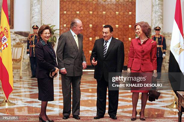 King of Spain Juan Carlos speaks with Egyptian President Hosni Mubarak as Spain's Queen Sofia and Egypt's first lady Suzanne Mubarak look on at the...