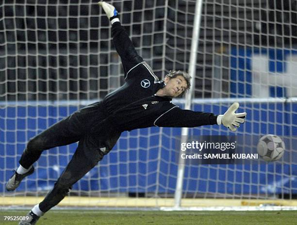 Goalkeeper Jens Lehmann of the German national soccer team jumps for the ball during a training session in Vienna February 5 on the eve of a friendly...