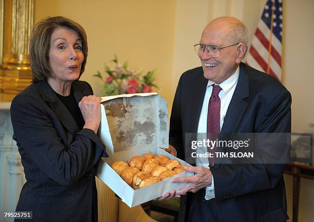 Speaker of the House Nancy Pelosi is given a box of paczki, a traditional pastry commonly eaten on Fat Tuesday, from the Chene Modern Bakery in...