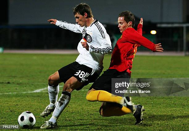 Benedikt Hoewedes of Germany in action with Anthony van Loo of Belgium during the friendly match between U21 of Germany and U23 of Belgium at the...