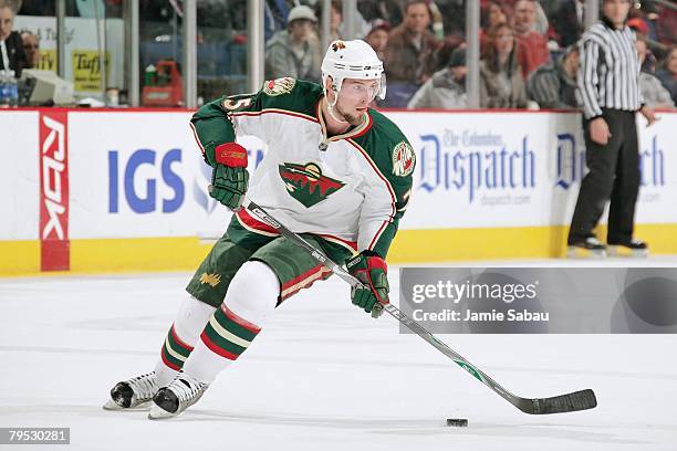 Eric Belanger of the Minnesota Wild skates with the puck against the Columbus Blue Jackets on February 2, 2008 at Nationwide Arena in Columbus, Ohio.