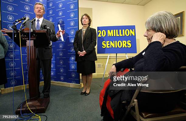 Sen. Max Baucus speaks as Sen. Blanche Lincoln and local senior citizen Elizabeth Sullam look on during a news conference on Capitol Hill February 5,...