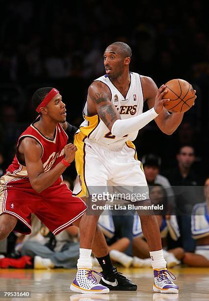 Kobe Bryant of the Los Angeles Lakers looks to pass against Daniel Gibson of the Cleveland Cavaliers at Staples Center on January 27, 2008 in Los...