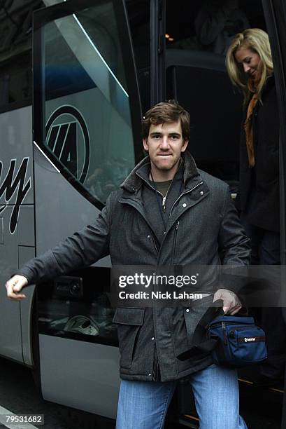 Eli Manning followed by his fiance Abby McGrew, step off the bus prior to the New York Giants Super Bowl XLII victory parade February 5, 2008 in New...