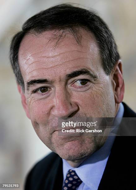 Former Arkansas Governor and Republican presidential hopeful Mike Huckabee attends a press conference shortly after he cast his ballot for the...