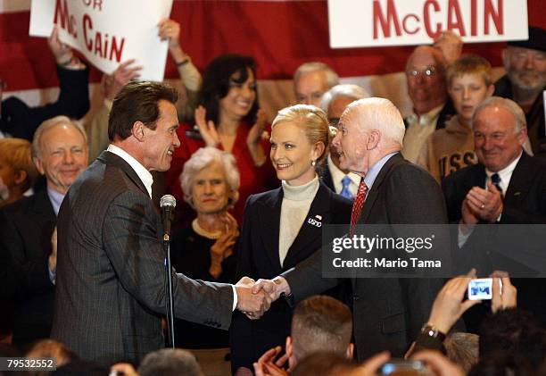 Republican presidential candidate and Senator John McCain shakes hands with California Gov. Arnold Schwarzenegger as Sen. Joe Lieberman , Roberta...