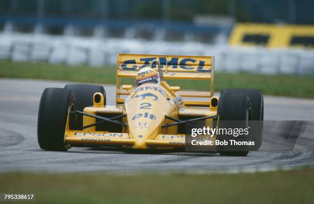 Japanese racing driver Satoru Nakajima drives the Camel Team Lotus Honda Lotus 100T Honda V6 to finish in 6th place in the 1988 Brazilian Grand Prix...