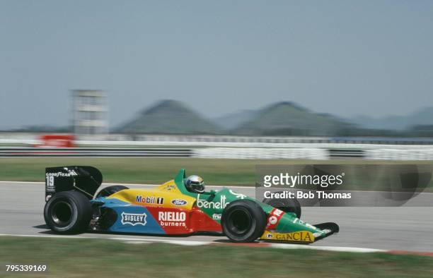 Italian racing driver Alessandro Nannini drives the Benetton Formula Ltd Benetton B188 Ford DFR V8 in the 1988 Brazilian Grand Prix at Autodromo...
