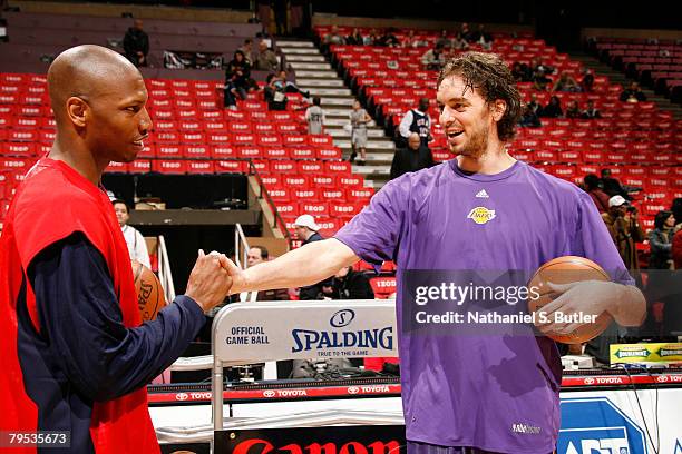 Pau Gasol of the Los Angeles Lakers greets former teammate Stromile Swift of the New Jersey Nets before their game on February 5, 2008 at the IZOD...