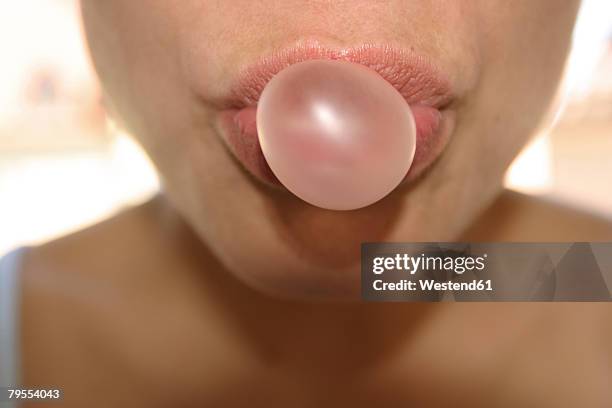 woman doing chewing gum bubble - bubble gum bubble stock pictures, royalty-free photos & images