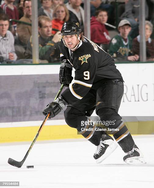 Mike Modano of the Dallas Stars looks to pass to a teammate against the Vancouver Canucks at the American Airlines Center on February 5, 2008 in...