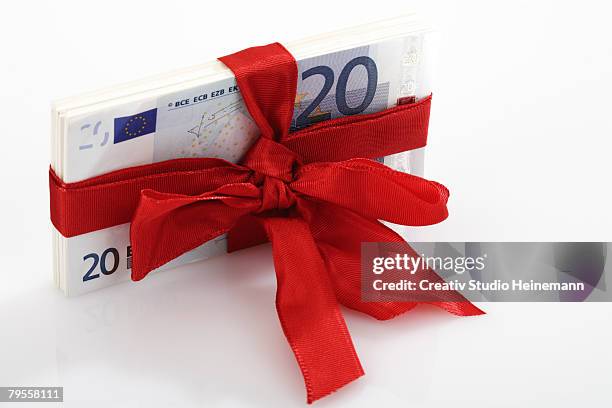 bunch of banknotes tied as gift - valuta stock pictures, royalty-free photos & images