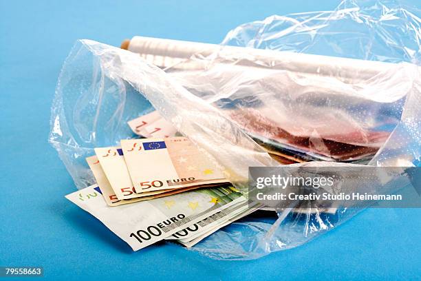 euro notes in clingfilm - valuta stock pictures, royalty-free photos & images