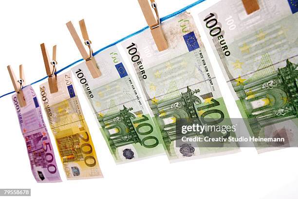 euro notes on clothesline - valuta stock pictures, royalty-free photos & images