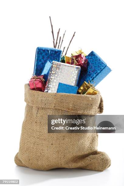 christmas santa sac with presents - sack stock pictures, royalty-free photos & images
