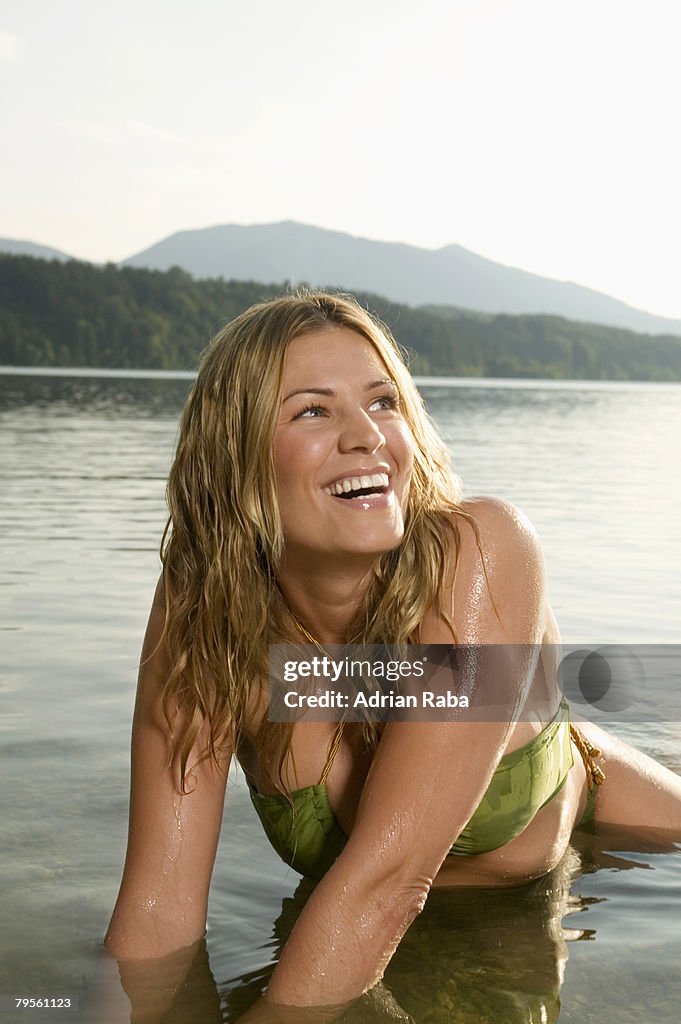 Woman bathing in lake