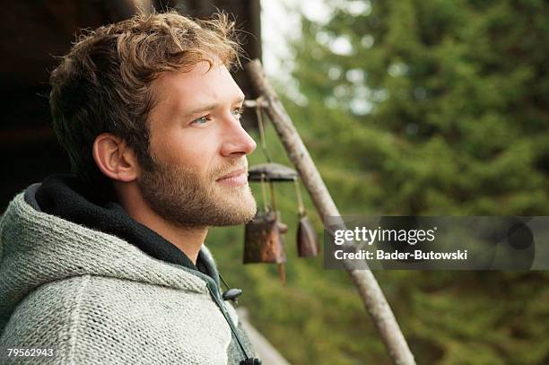 young man in front of hut - natural blonde stock-fotos und bilder