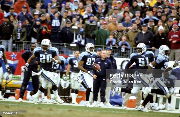 Tennessee Titans wide receiver Kevin Dyson takes a kickoff return 75 yards for a touchdown during the AFC Wildcard Playoff, a 22-16 victory over the...