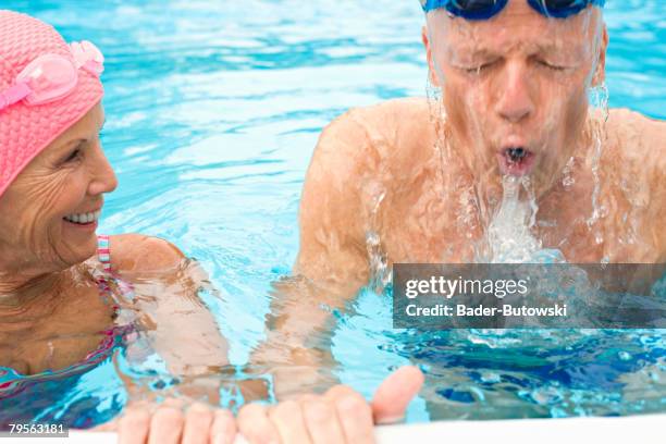 germany, senior couple in swimming pool - bathhouse stock pictures, royalty-free photos & images