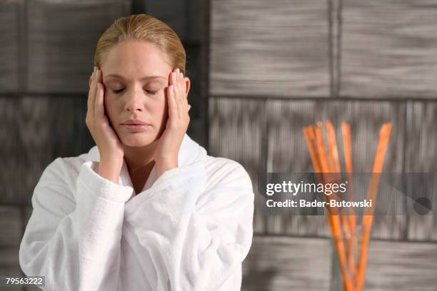 germany, woman, hands on temples, close-up - massaggio del viso foto e immagini stock