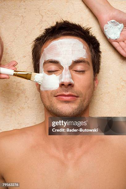 germany, man getting a facial, close-up - men facial stock pictures, royalty-free photos & images