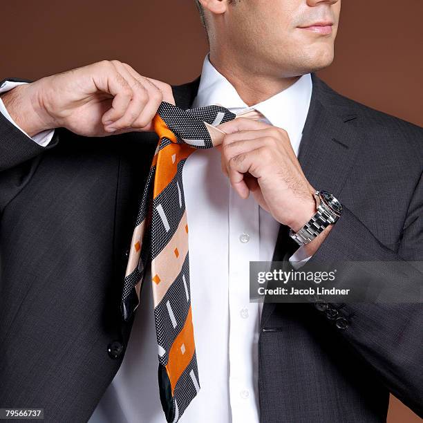 businessman wearing suit and tie, close-up - tie close up stock-fotos und bilder