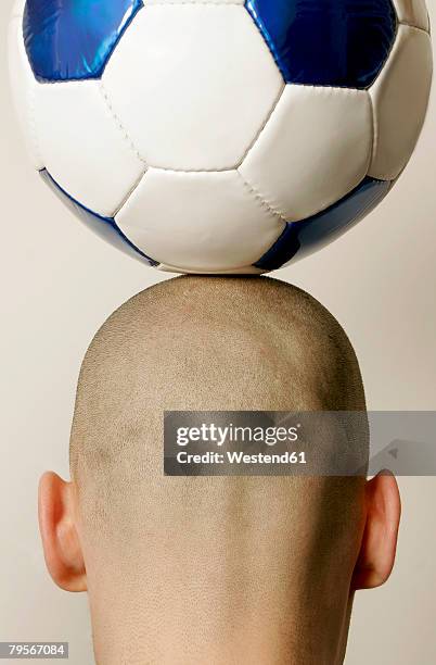 man with soccer ball on head, rear view, close-up - bald football supporter stock pictures, royalty-free photos & images