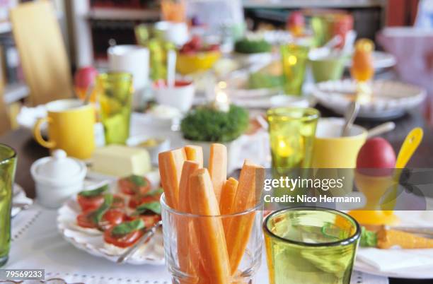 easter table setting, focus on carrot slices in glass - easter breakfast stock pictures, royalty-free photos & images