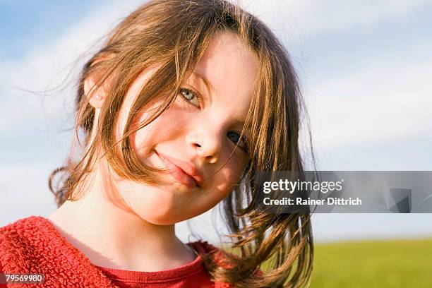 girl (7-9) smiling, portrait - kids kindness stock pictures, royalty-free photos & images