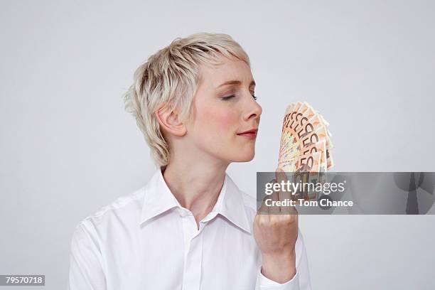 young woman holding money, portrait - carbon copy receipt stock pictures, royalty-free photos & images