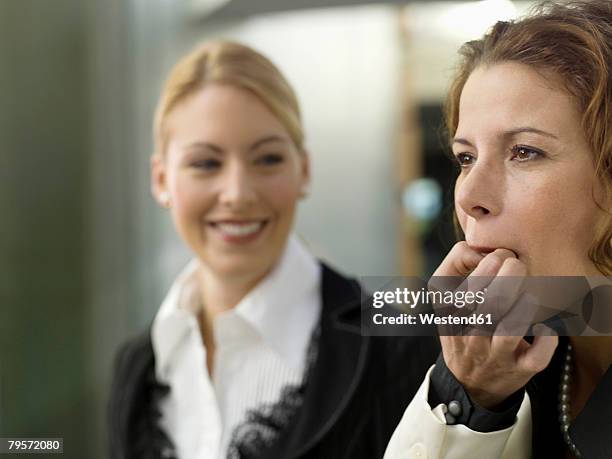 businesswomen whistling on fingers - whistling at woman stock pictures, royalty-free photos & images