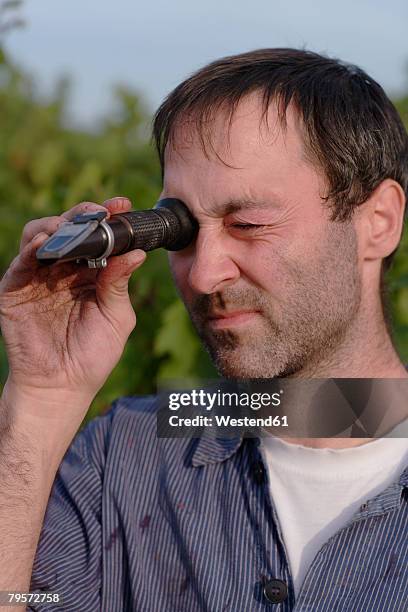 man using refractometer - refractometer stock pictures, royalty-free photos & images