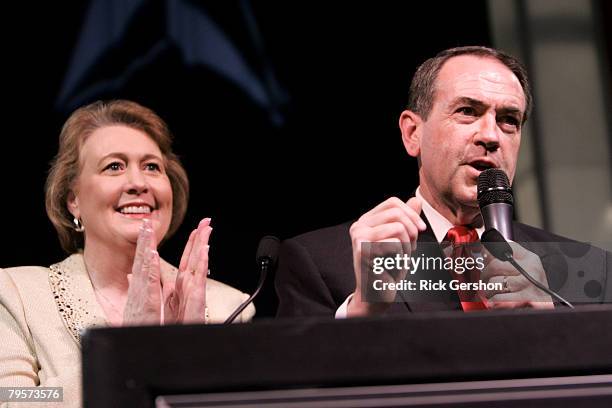 Republican presidential hopeful Mike Huckabee and his wife Janet take the stage to celebrate with supporters at a Super Tuesday watch party on...