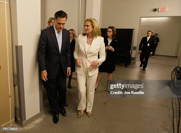 Republican presidential candidate and former Massachusetts governor Mitt Romney and his wife Ann Romney walk together back stage before being...