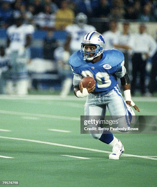 Hall of Fame running back Barry Sanders of the Detroit Lions carries the football and looks for room to run during the Lions 38-6 victory over the...