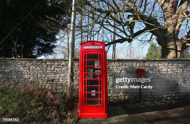 Traditional red telephone box stands empty in the village of Priston on February 6, 2008 near Bath, Somerset, England. According to BT payphone use...