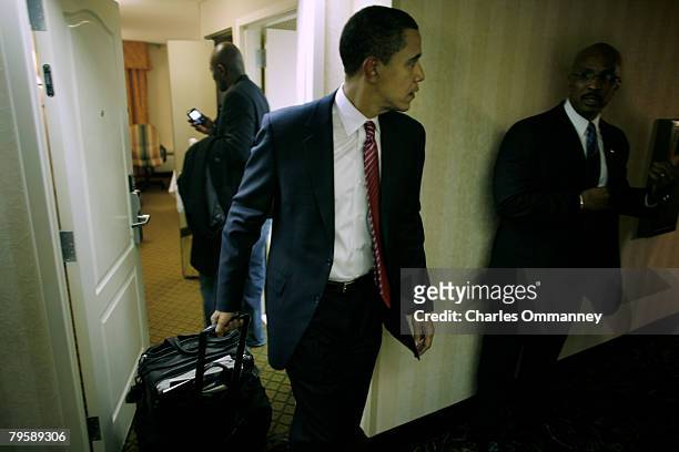 Presidential candidate Sen. Barack Obama and his wife Michelle Obama, advisor David Axelrod and communications director Robert Gibbs leave the hotel...