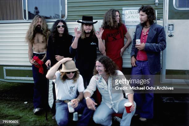 Southern Rock band Lynyrd Skynyrd pose by their trailer backstage at an outdoor concert in October, 1976 in California.