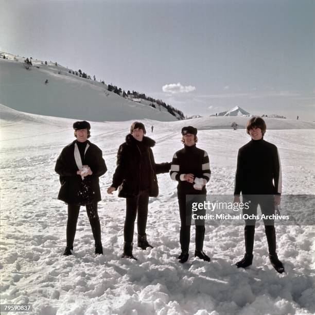 The Beatles John Lennon, Paul McCartney, Ringo Starr and George Harrison pose for a photo in the snow in March 1965 in Obertauern, Austria during a...