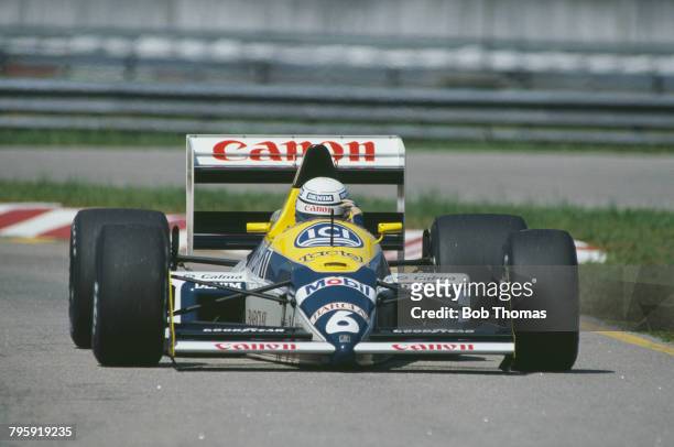 Italian racing driver Riccardo Patrese drives the Canon Williams Team Williams FW12 Judd CV 3.5 V8 in the 1988 Brazilian Grand Prix at Autodromo...