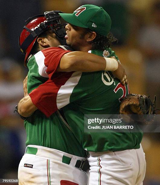 Nelson Figueroa and Said Gutierrez of the Mexican Yaquis celebrate their victory against the Tigres del Licey of the Dominican Republic during a...