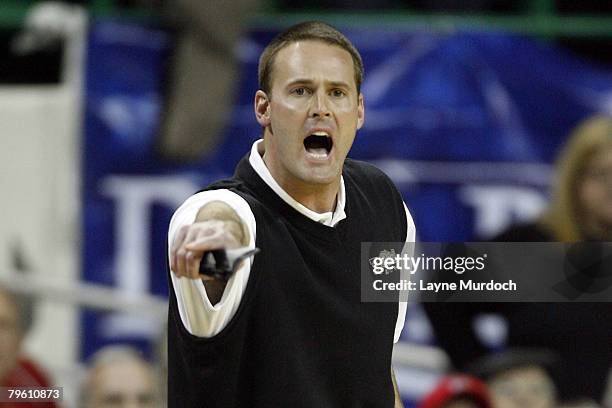 Pat Knight, Head Coach of the University of Texas Tech Red Raiders basketball team shouts instructions to his team as they take on the University of...