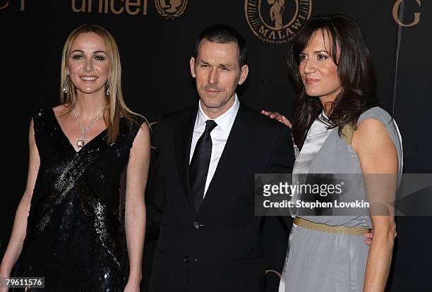 Gucci designer Frida Giannini, Gucci CEO Mark Lee and Gucci President Daniella Vitale attend a reception to benefit UNICEF hosted by Gucci during...