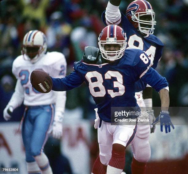 Buffalo Bills wide receiver Andre Reed scores on an 18-yard touchdown catch during the Bills 41-38 overtime victory over the Houston Oilers in the...