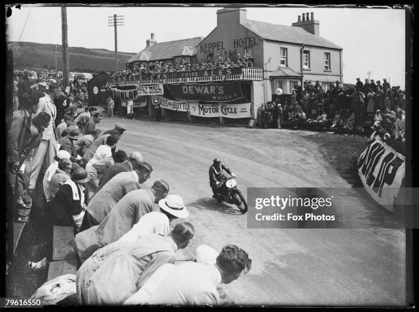 Stanley Woods psases the Keppel Hotel in Creg-ny-Baa on his Velocette during the Senior TT Race on the Isle of Man, 19th June 1936. He came in second.