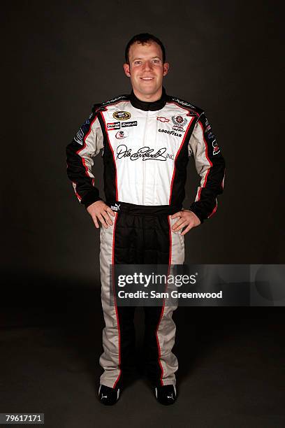 Regan Smith, driver of the DEI Chevrolet, poses for a photo during the NASCAR Sprint Cup Series media day at Daytona International Speedway on...