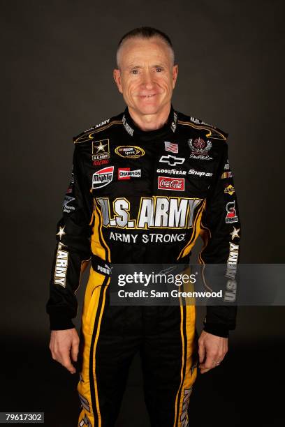 Mark Martin, driver of the U.S. Army Chevrolet, poses for a photo during the NASCAR Sprint Cup Series media day at Daytona International Speedway on...