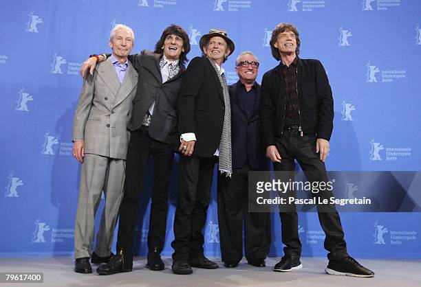 Rolling Stones singer Mick Jagger and band mates Ronnie Wood, Charlie Watts and Keith Richards pose with Director Martin Scorsese at the 'Shine A...