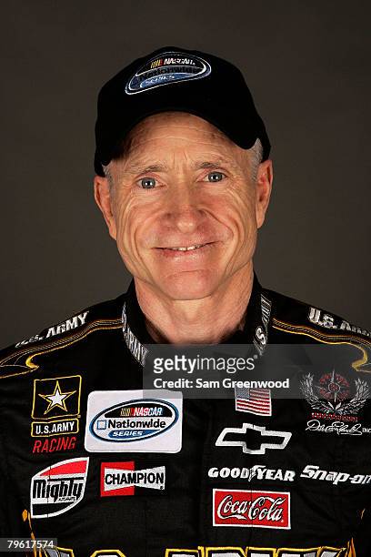 Mark Martin, driver of the U.S. Army Chevrolet, poses for a photo during the NASCAR Sprint Cup Series media day at Daytona International Speedway on...